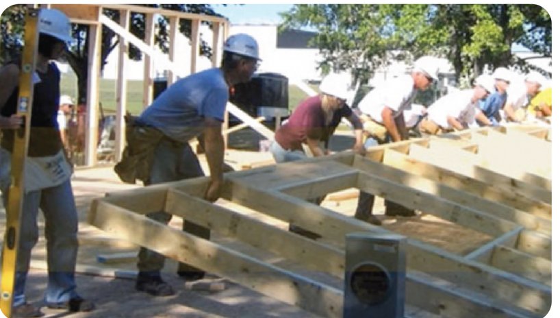 Volunteers and students working on a build project
